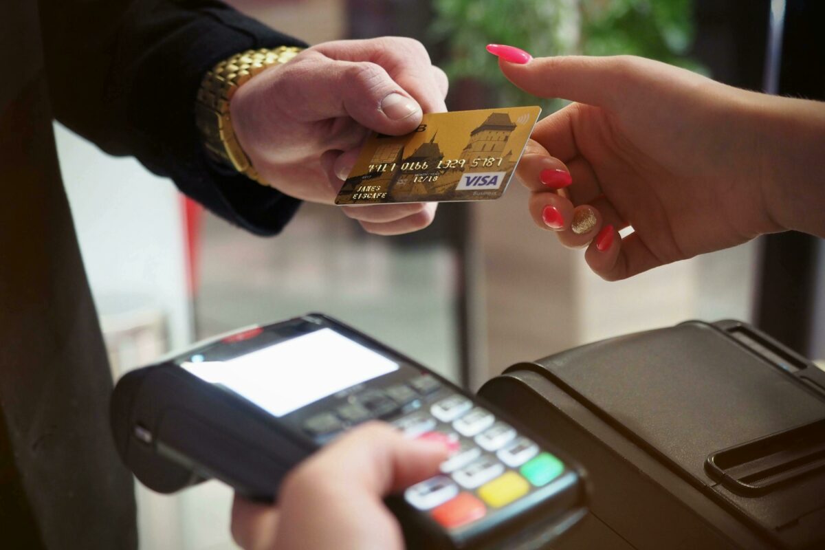 How can merchants save money with credit card surcharging?